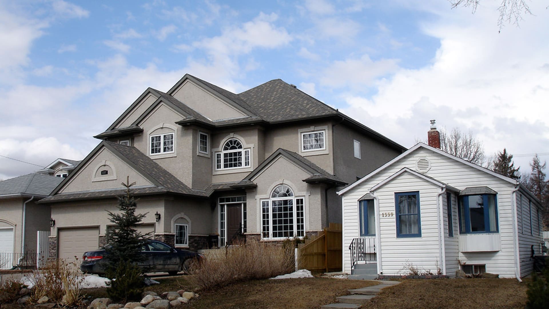 Two-story suburban home with an architectural shingle roof