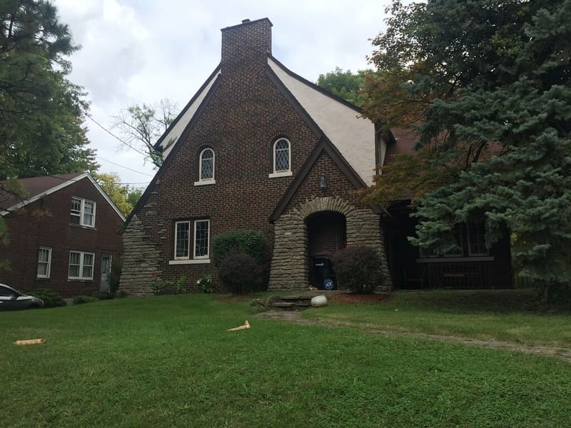 Brick home exterior with roof and siding details