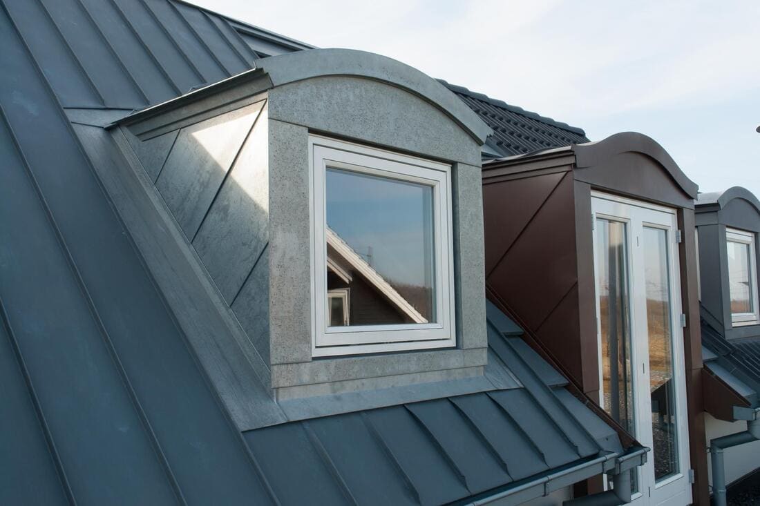 Standing-seam dormers on a sloped roof